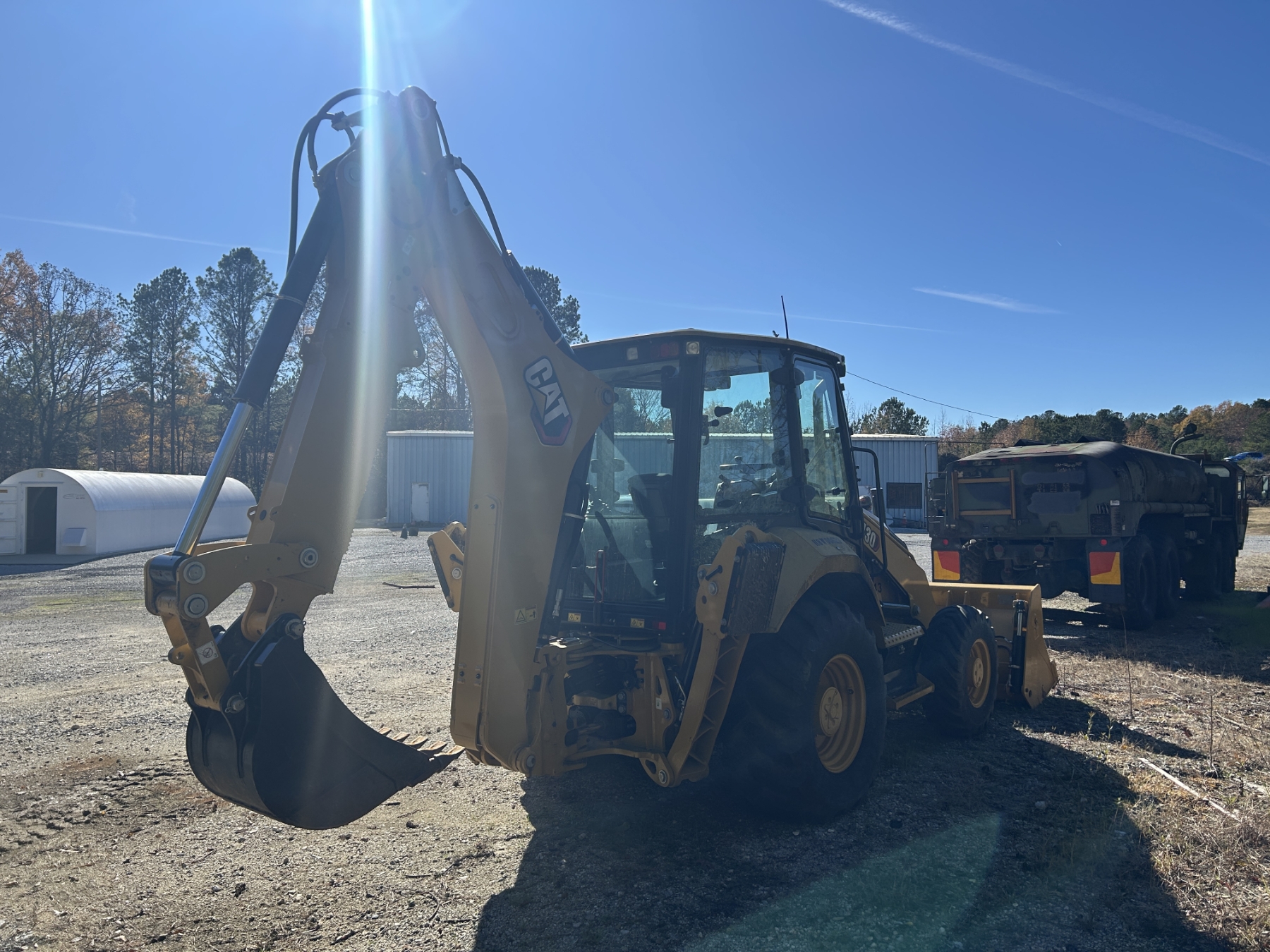 430 Backhoe 2022 CAT 430 Backhoe - J.M. Wood Auction Company, Inc.
