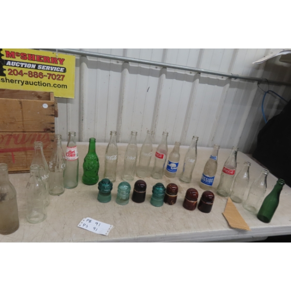 Seventeen Pop Bottles, Two Glass Insulators, and Wooden Crate