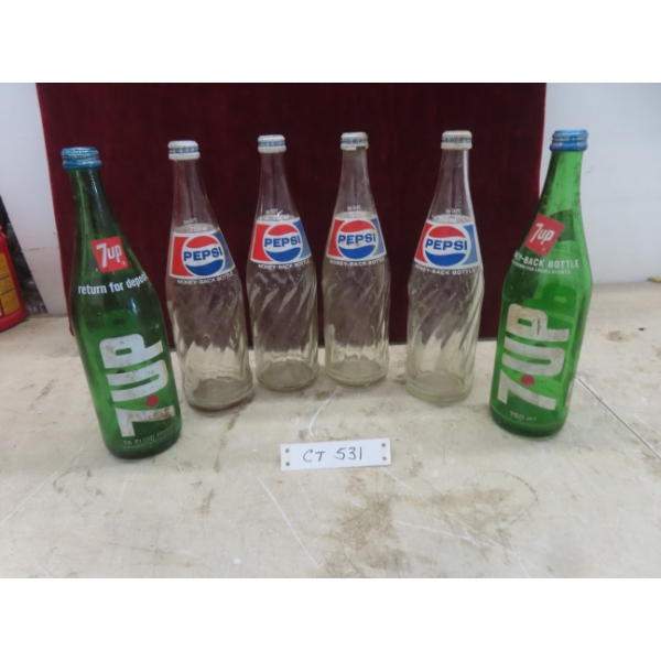 Six 26 Fluid Ounce Soda Bottles (Pepsi and 7 Up)