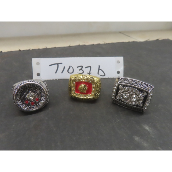Three Replica Championship Rings Featuring Oakland Raiders, St. Louis 1987 National League, And