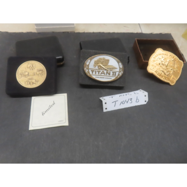 Two Collectible Belt Buckles Featuring John Deere And National Finals Rodeo, 1985