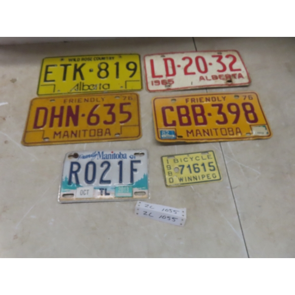 License Plates Including Two Alberta 1985 Plates, Manitoba 1976 Plate, Trailer Plate, And 1980
