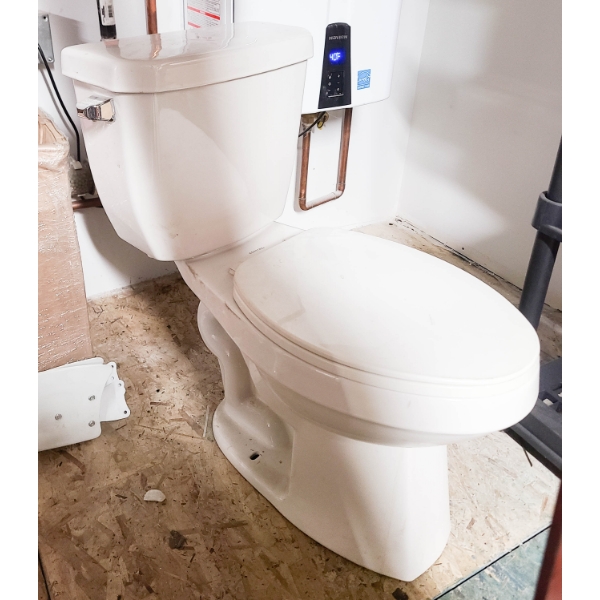 NEW ELONGATED TOILET 