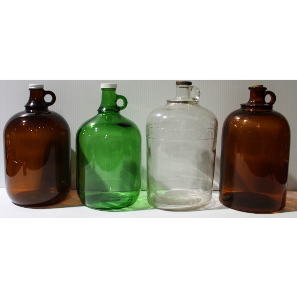 4 VINTAGE GLASS JUGS W/ CAPS/STOPPER - BRN/AMBER - GREEN & CLEAR
