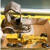 Image 2 : VINTAGE DIECAST CATERPILLAR GRADER & TIN MUSIC BOX CAR