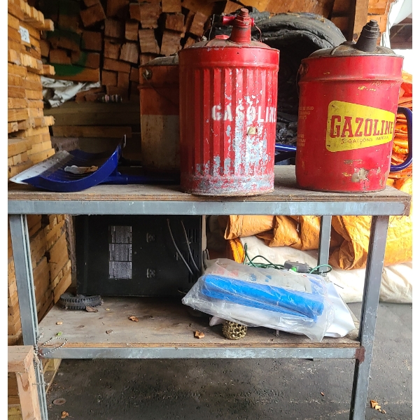 BENCH W/ VINTAGE FUEL CANS TARP BATTERY CHARGER ETC.