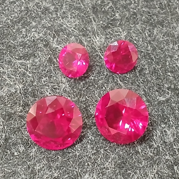 LOT OF 4 - LAB-CREATED RUBIES - ROUND BRILLIANT CUT