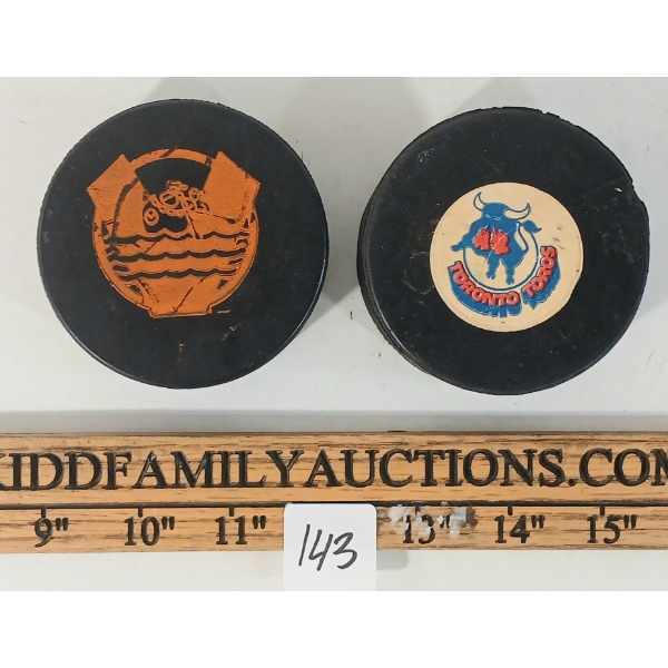 LOT OF 2 - NOVA SCOTIA VOYAGERS & TORONTO TOROS HOCKEY PUCKS