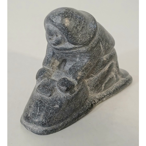 "WOMAN SCRAPING SKIN" BY CHARLIE SIVUARAPIK (1911-1968) - STONE