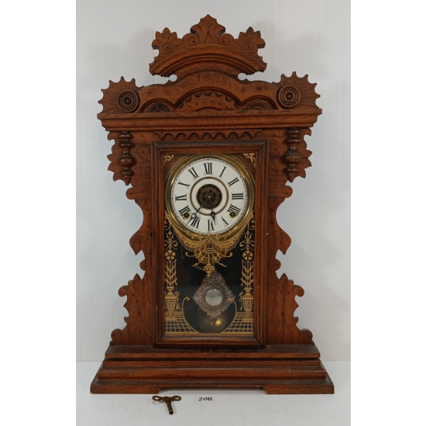 1894 E. INGRAHAM GINGERBREAD "PUCK" 8 DAY OAK SHELF CLOCK