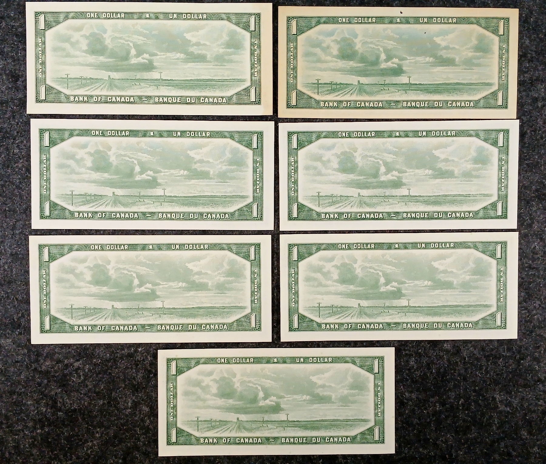 LOT OF 7 - 1954 CDN $1 BANKNOTES - INCL DEVIL'S FACE, REPLACEMENT NOTE ...