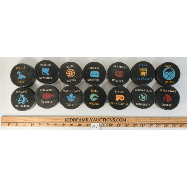 LOT OF 14 - 1970-19 NHL HOCKEY PUCKS - CANADIENS, MAPLE LEAFS, NORTH STARS, FLYERS, BRUINS, ETC