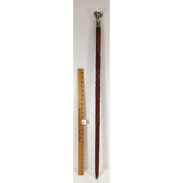 CARVED WALKING STICK W/ DESIGNED SILVER POMMEL