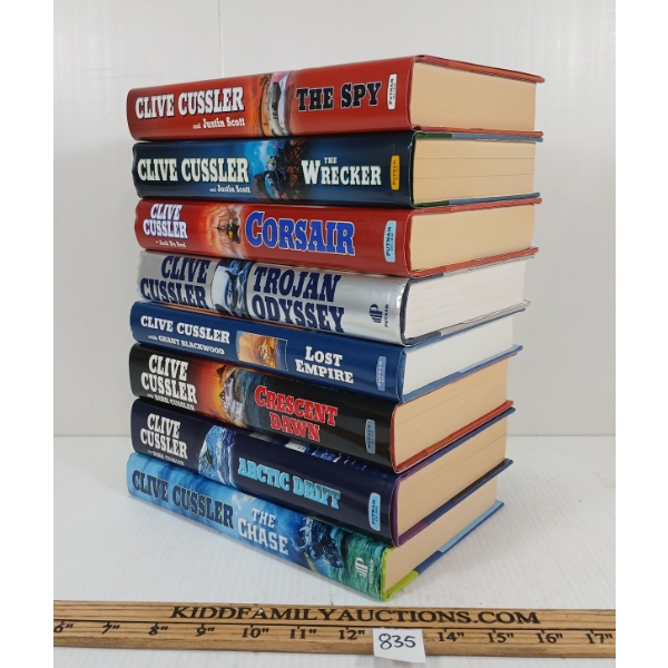 LOT OF 8 - CLIVE CUSSLER NOVELS - INCL CRESCENT DAWN, ARCTIC DRIFT, TROJAN ODYSSEY, ETC