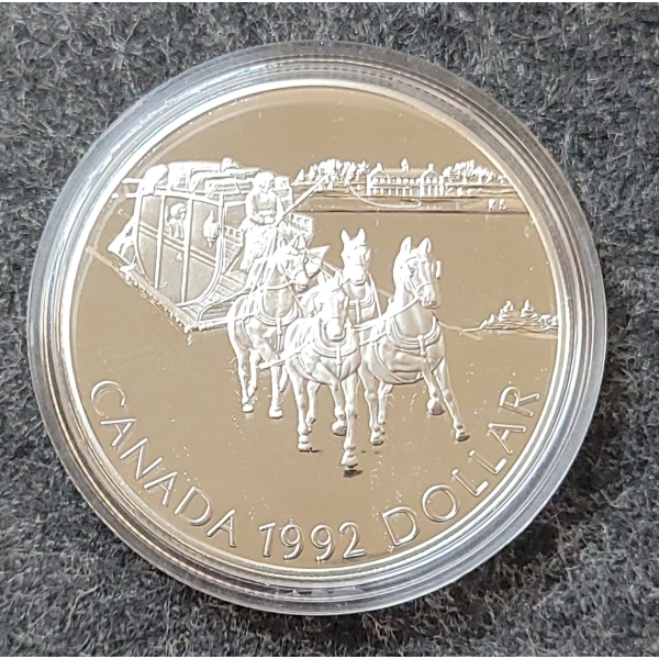 1992 RCM SILVER DOLLAR COIN