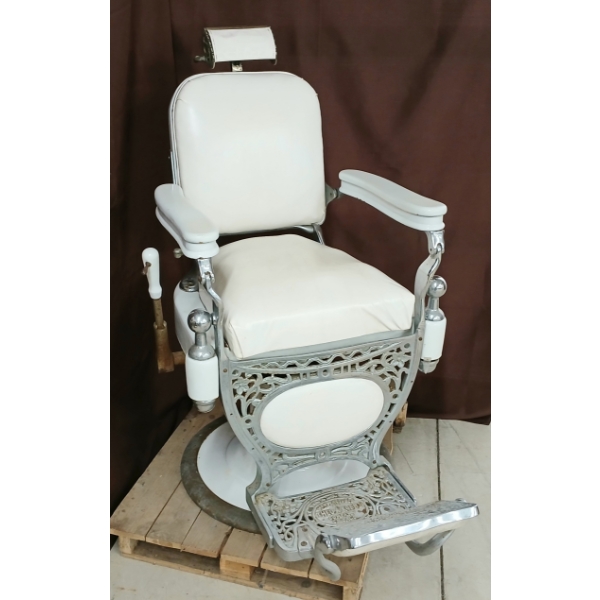 THEO A. KOCHS HYDRAULIC BARBER CHAIR W/ PORCELAIN BASE - C. 1910-1930