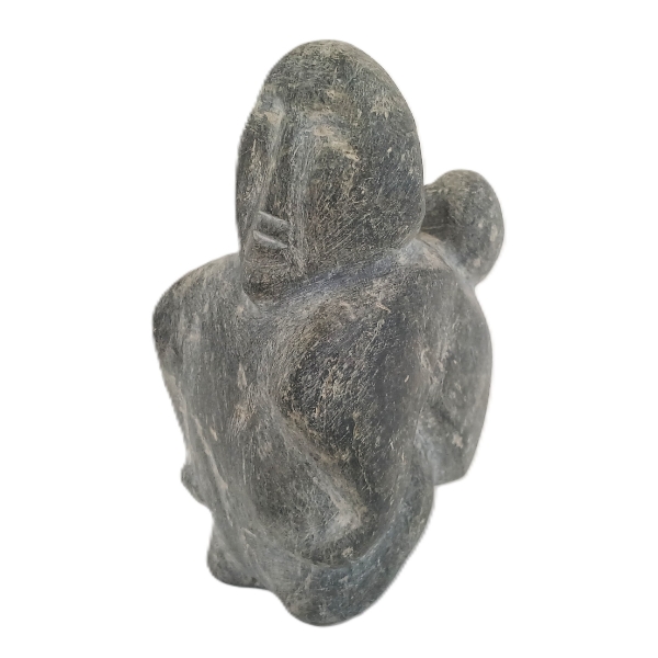 MOTHER CARRYING CHILD BY JOY KILUVIGYUAK (1940 - 2000) - STONE