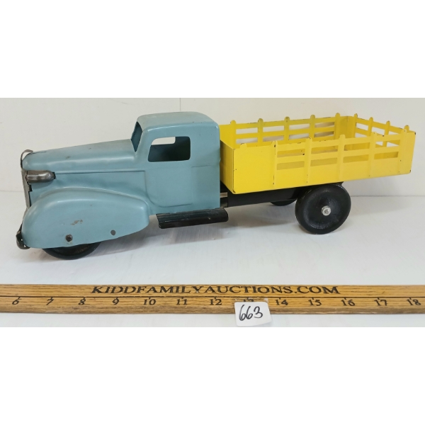 WYANDOTTE PRESSED STEEL STAKE TRUCK W/ WOODEN WHEELS