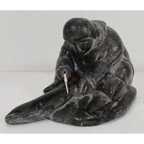INUK SKINNING FISH BY PILUPUSI PUTUGU (1918- ?)  - STONE & BONE 