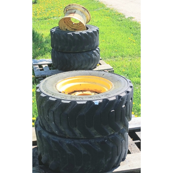 LOT OF 4 - GALAXY SKIDSTEER RIMS & TIRES