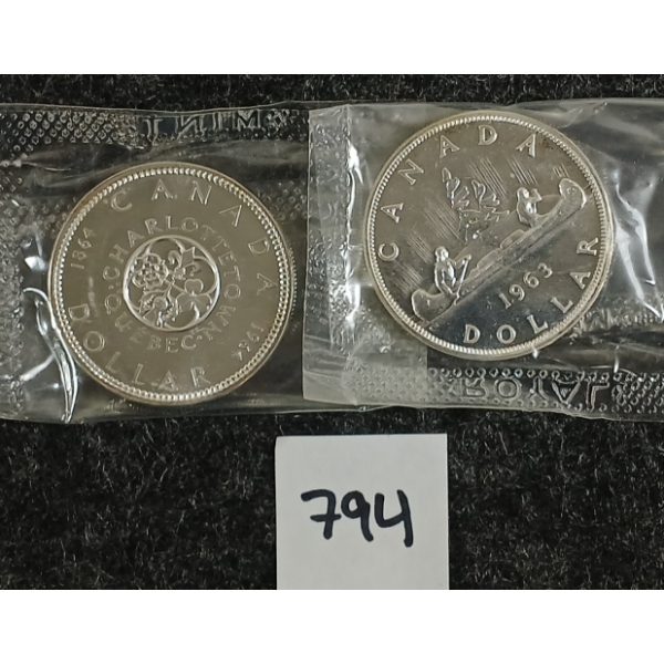 LOT OF 2 - 1963-1964 CDN VOYAGEUR & CHARLOTTETOWN SILVER DOLLAR COINS 