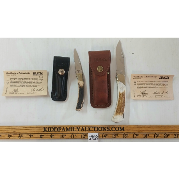 LOT OF 2 - FOLDING BUCK KNIVES W/ SHEATHS