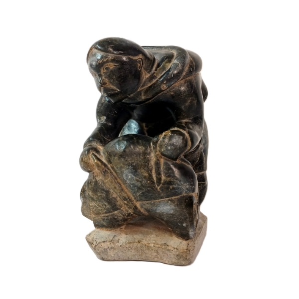 MAN HAULING BY THOMASSIE SIVUARAPIK (1941 - 2009) - STONE