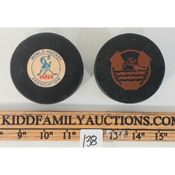 LOT OF 2 - NOVA SCOTIA VOYAGERS & TORONTO TOROS HOCKEY PUCKS