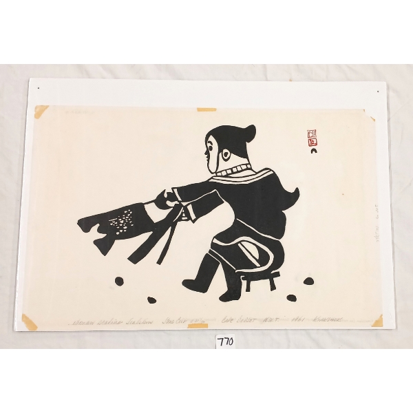 "WOMAN SCALING SEALSKIN" BY KENOJUAK ASHEVAK (1927 - 2013) - STONECUT