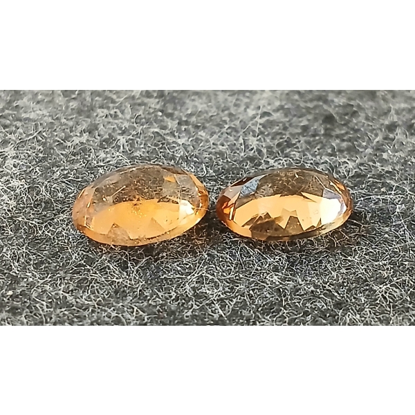 PAIR OF NATURAL IMPERIAL TOPAZES - OVAL MIXED CUT ($17,000)