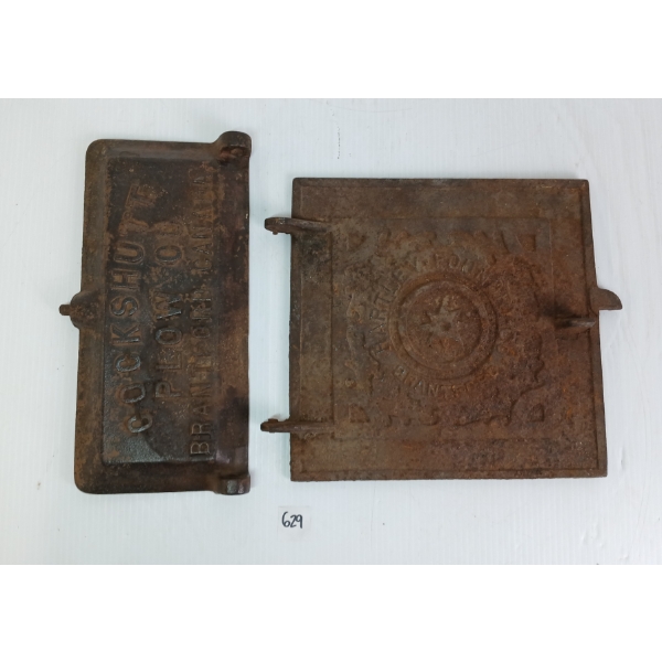 LOT OF 2 - CAST IRON DOORS - INCL COCKSHUTT PLOW CO. & HARTLEY FOUNDRY CO.