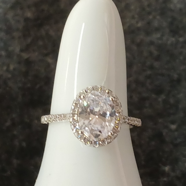 STERLING SILVER & SIMULATED DIAMOND HALO RING - OVAL CUT