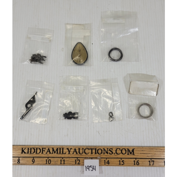 LOT OF 7 - REMINGTON 1100-1187 PARTS - INCL CARRIER LATCH, ETC