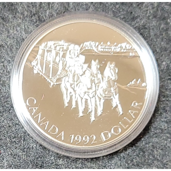 1992 RCM SILVER DOLLAR COIN