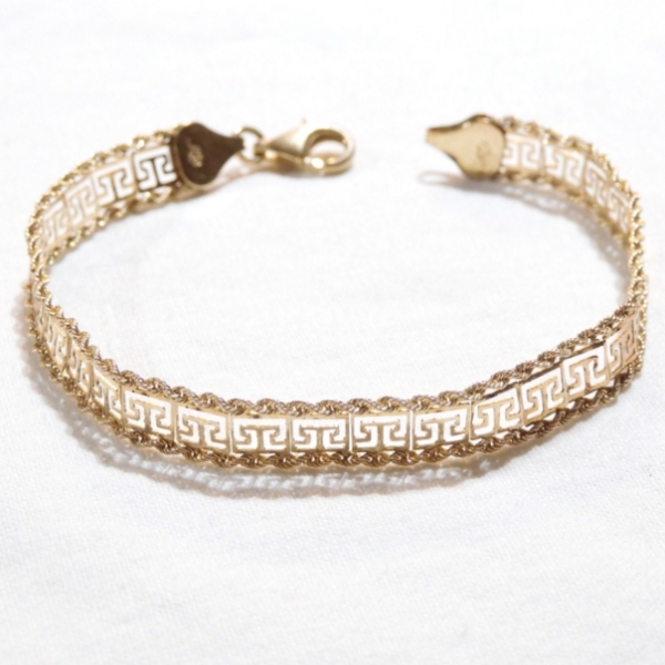 Lady's 10K Yellow Gold Aztec Design Bracelet w/ Lobster Clasp. 6 3/4" Length & 3.98 grams. 