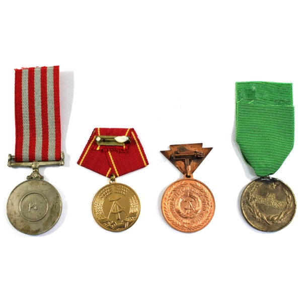Lot of 4x International Medals. Some residue related to prior mounting.