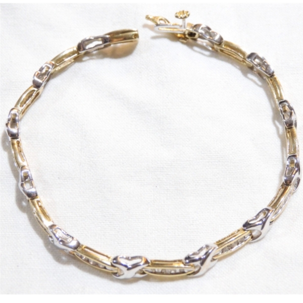 Lady's 14K Yellow & White Gold Channel Set Diamond Bracelet. 7" Length w/ Safety Catch. 9.1 grams. 