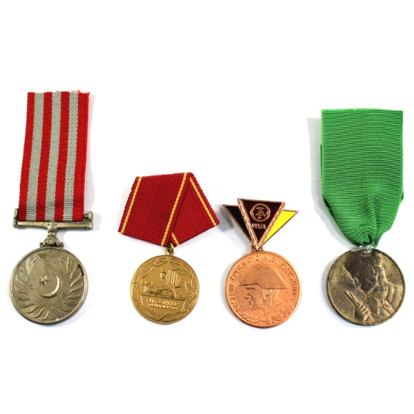 Lot of 4x International Medals. Some residue related to prior mounting.