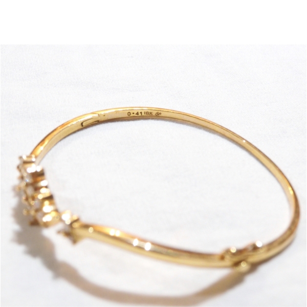 Lady's 18K Yellow Gold Diamond Hinged Cuff Bracelet. Total weight of 11.09 grams.