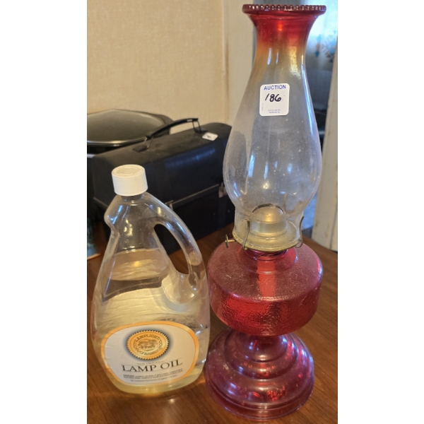 Red Oil Lamp with Bottle of Lamp Oil