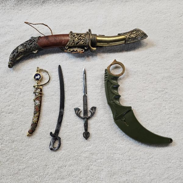 Assortment of Decorative Miniature Weapons, Collectible Replica Daggers, and Letter Openers