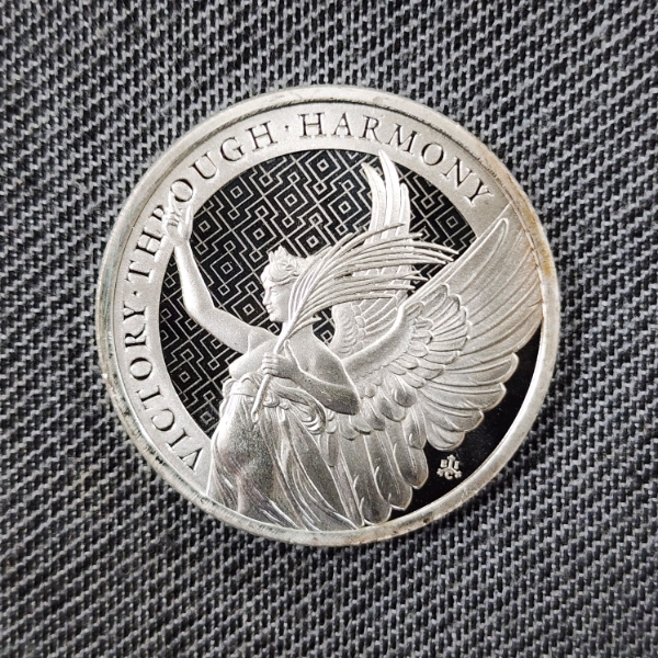One Troy Ounce .999 Fine Silver Victory Through Harmony Angel Round