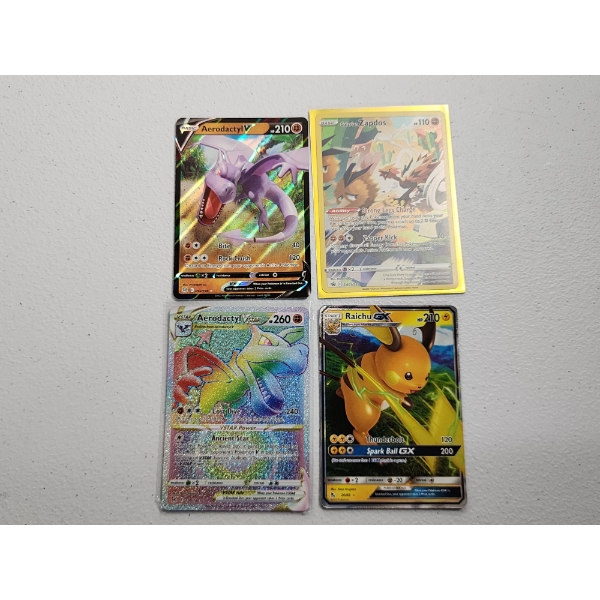 4 Near Mint Pokemon Cards: Aerodactyl V, Zapdos, Aerodactyl VSTAR, and Raichu GX