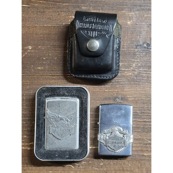 (2) Harley Davidson Zippo Lighters and a Harley Davidson Lighter Belt Case