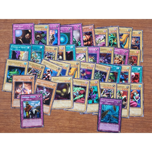 40 Assorted Vintage Yu-Gi-Oh Trading Cards Including 1st Edition & Holo Cards