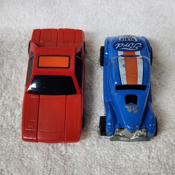 2 Vintage Toy Vehicles Including 1975 Ford Hot Wheel & Transformer