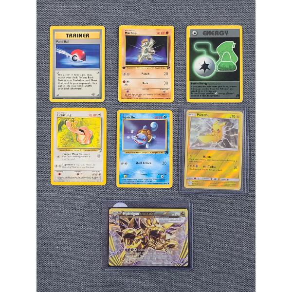 Seven Assorted Pokemon Trading Cards Including 1st Edition Rocket Set, Reverse Holo & Break Holo