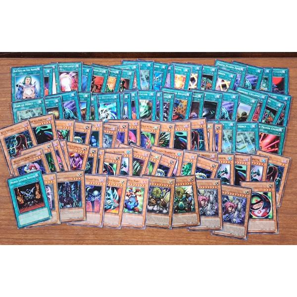 Over 80 Assorted Vintage Yu-Gi-Oh Trading Cards Including 1st Edition & Holo Cards