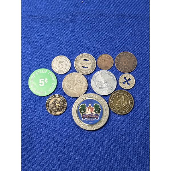 Lot of Assorted Tokens - 11 Items Total 
Bus tokens, plastic food stamp token, casino chip, car coin