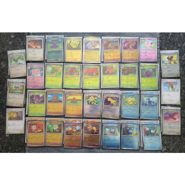 Large Lot of Over 60 Assorted Foreign Pokemon 151 Near Mint Common & Reverse Holo Trading Cards